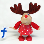 Rentier Suomi-Fan Friida, stehend mit Finnlandflagge